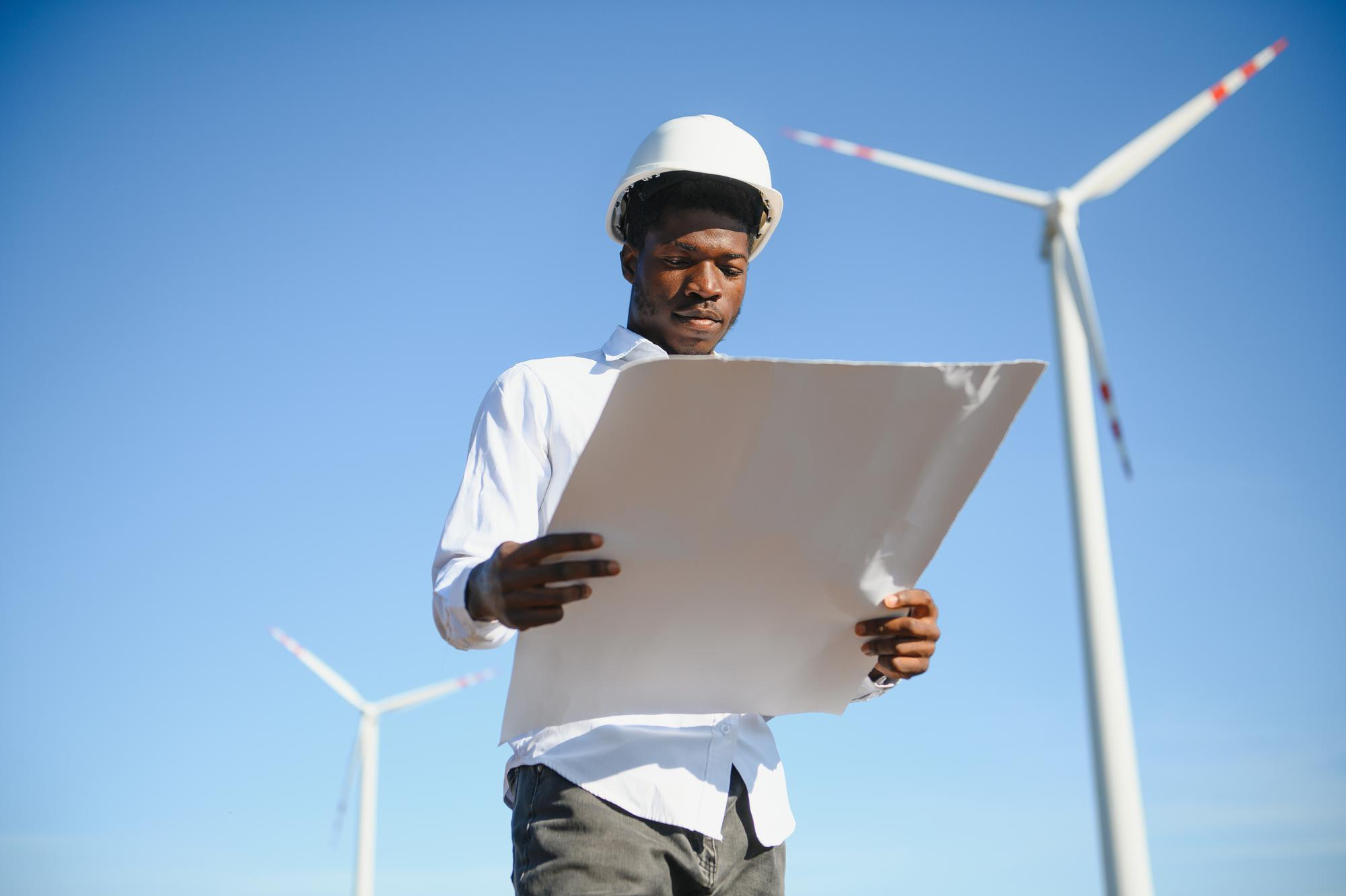 Young African energy professionals discussing a project together