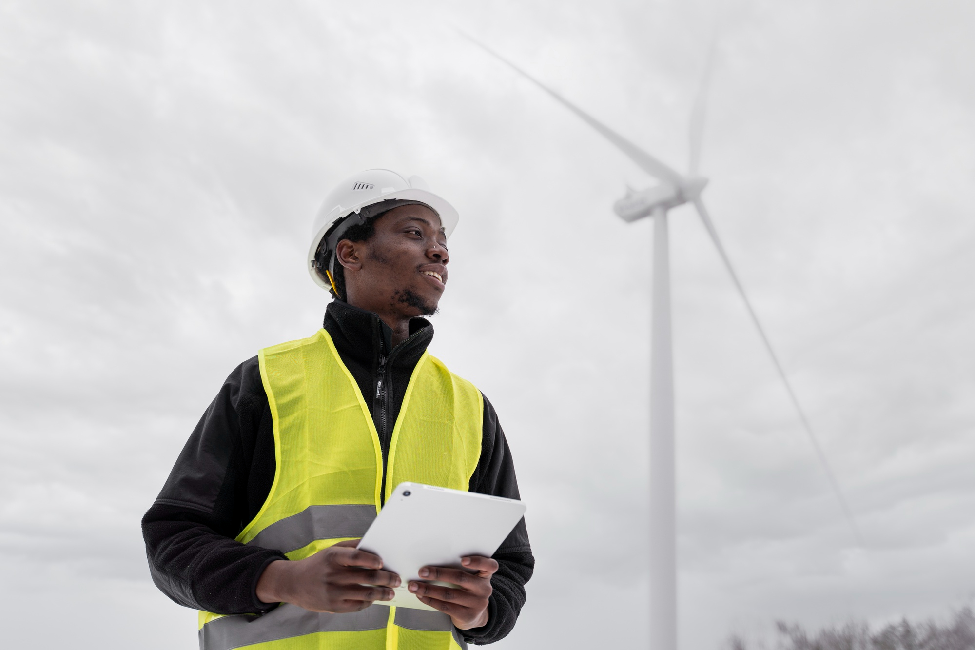Energy professional working near a wind installation